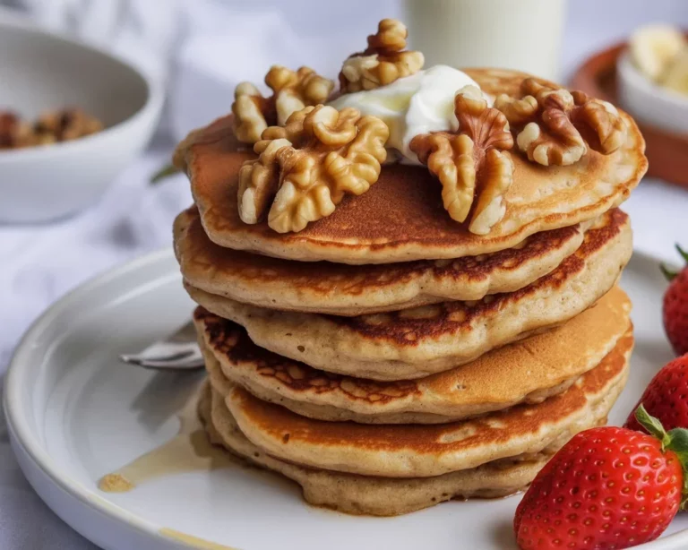 Vegane Haferflocken-Pfannkuchen ohne Mehl auf einem Teller serviert.